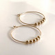 FLOATING BALLS HOOP HAMMERED EARRINGS